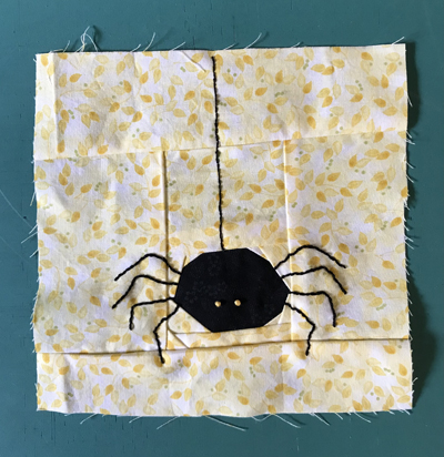 Paper pieced and embroidered spider quilt block www.dlstewart.com